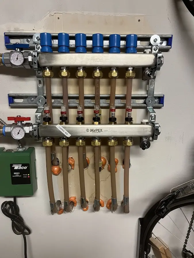 Plumber performing Water Heater Repair at a residential property in Booneville