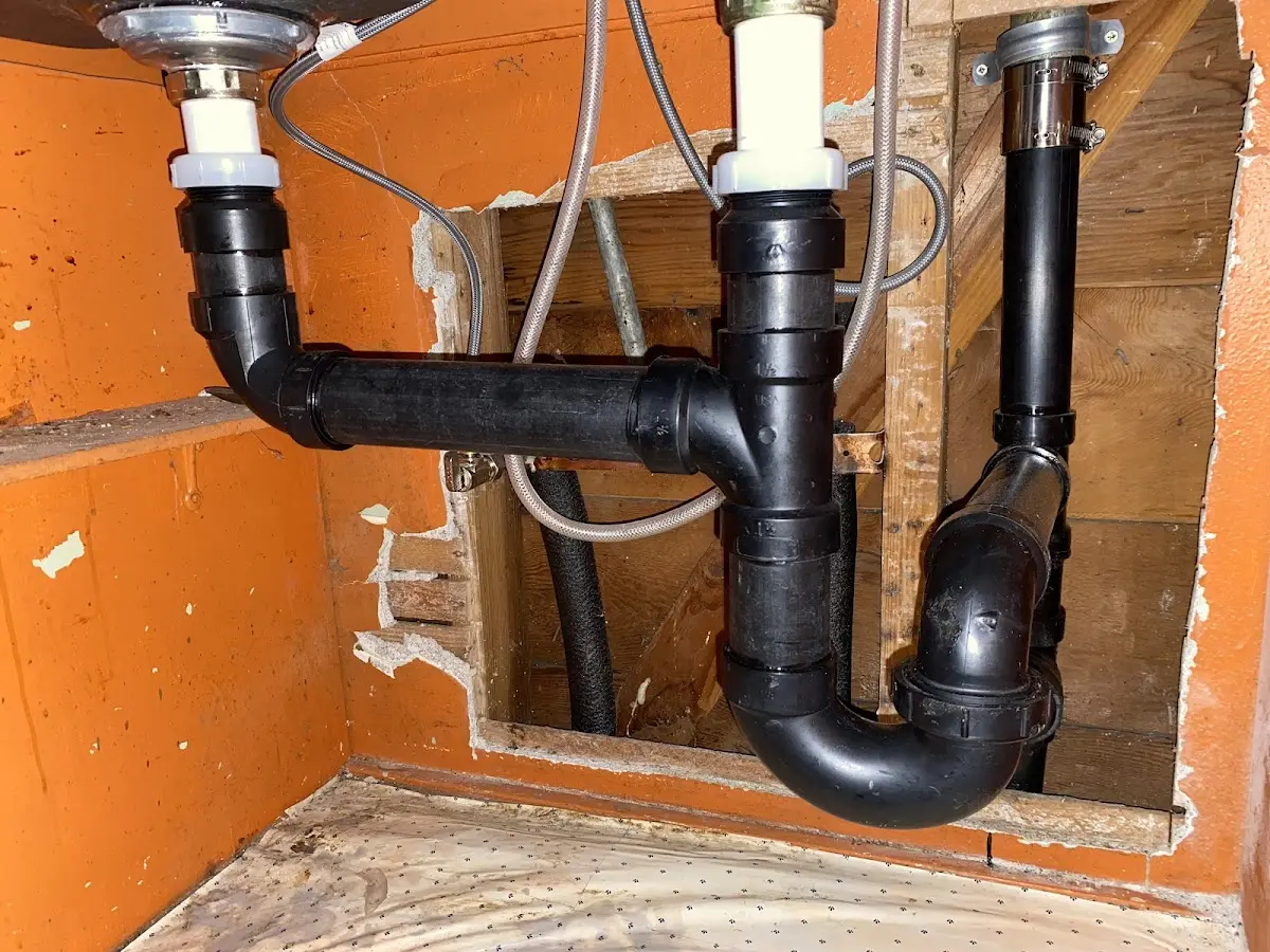 Professional Garbage Disposal Repair equipment and tools on the job in Booneville